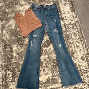 Distressed flare bottom jeans and a tank body suit